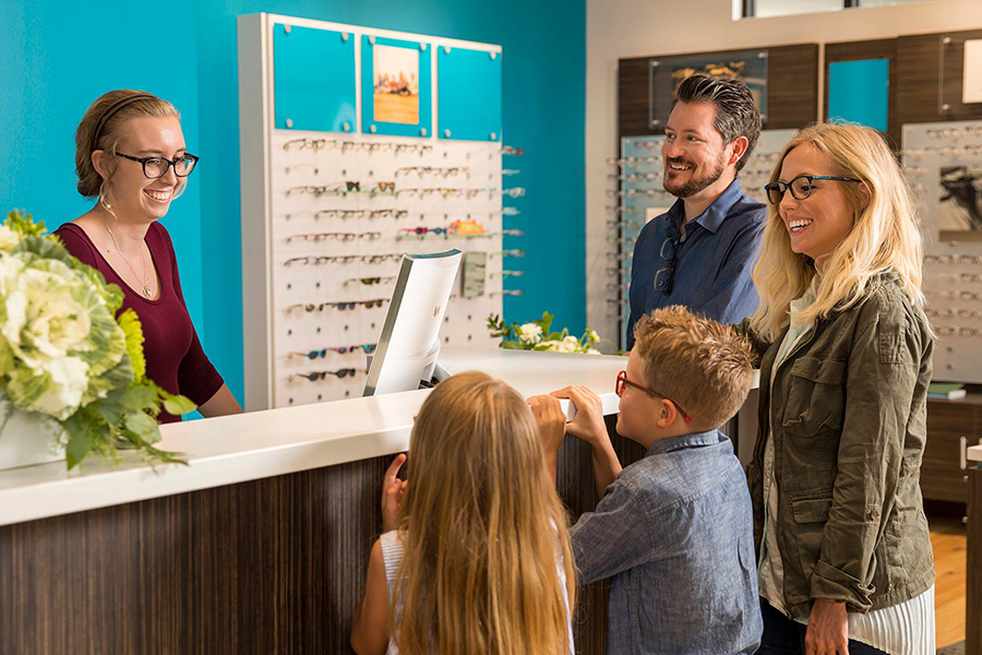 20Twenty-Optical-Eyecare-Positions-Bozeman-Montana Woman helping customers at 20Twenty Eyecare in Bozeman